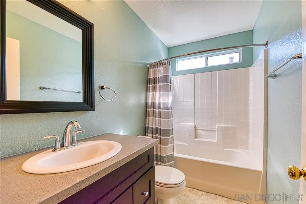 1314 Mill Valley Road Chula Vista, CA 91913 - Photo 15 of 25 a bathroom with a sink toilet and shower