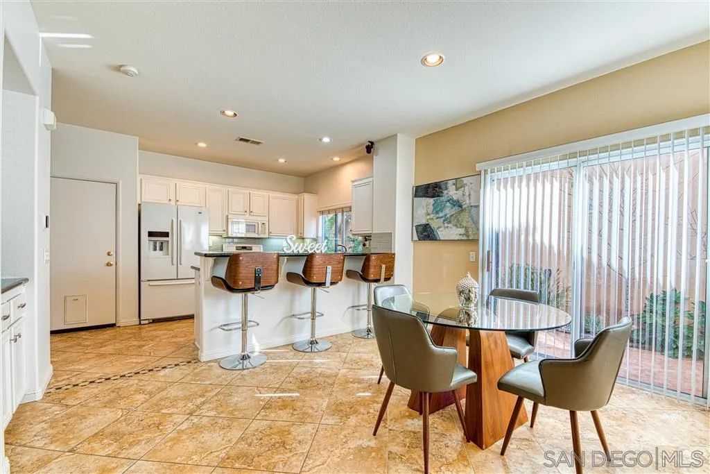 1314 Mill Valley Road Chula Vista, CA 91913 - Photo 9 of 25 a view of a dining room with furniture and a large window