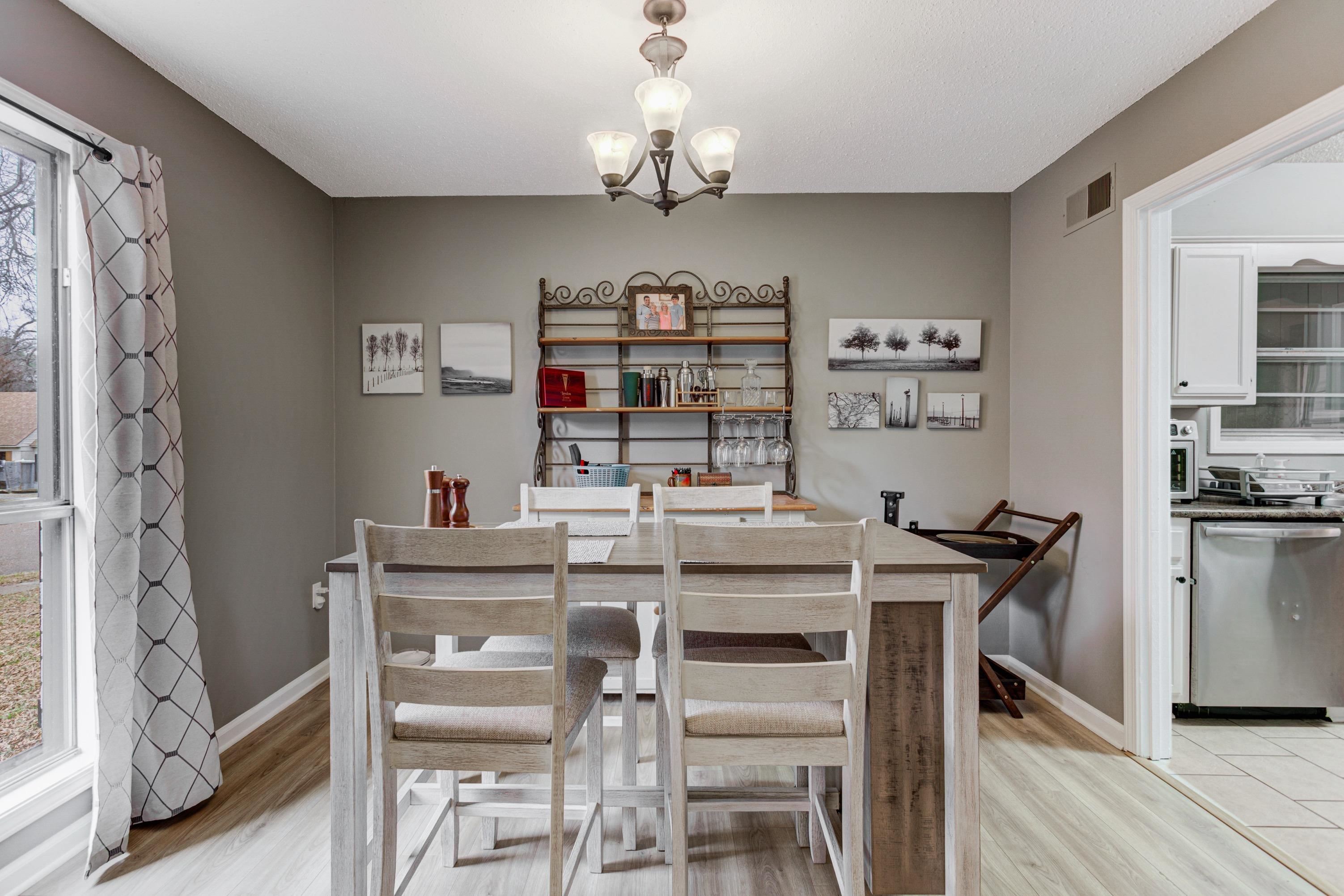 3224 Court Street Bartlett, TN 38134 - Photo 11 of 23 a view of a dining room with furniture a chandelier and wooden floor