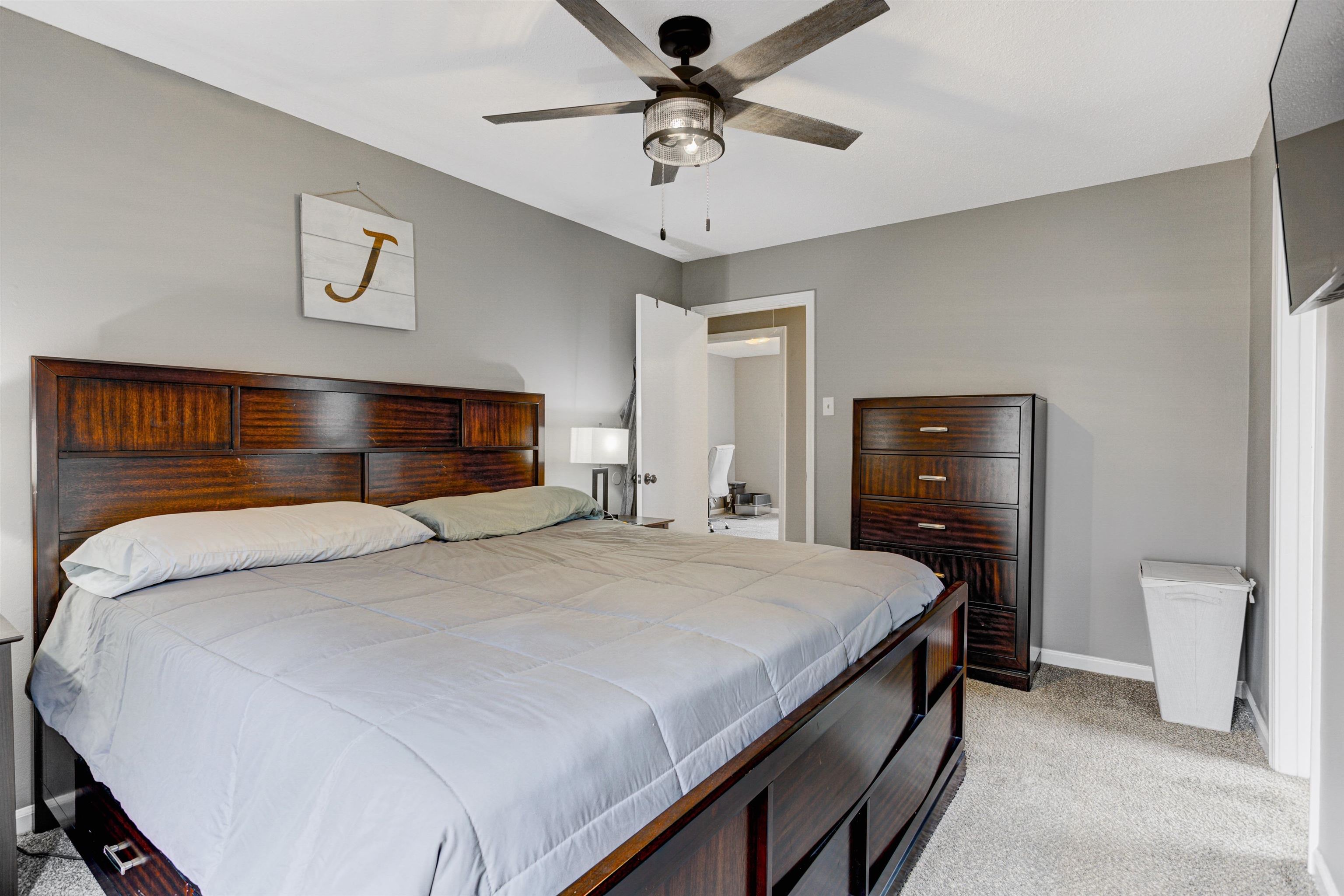 3224 Court Street Bartlett, TN 38134 - Photo 13 of 23 a bedroom with a bed and a chandelier