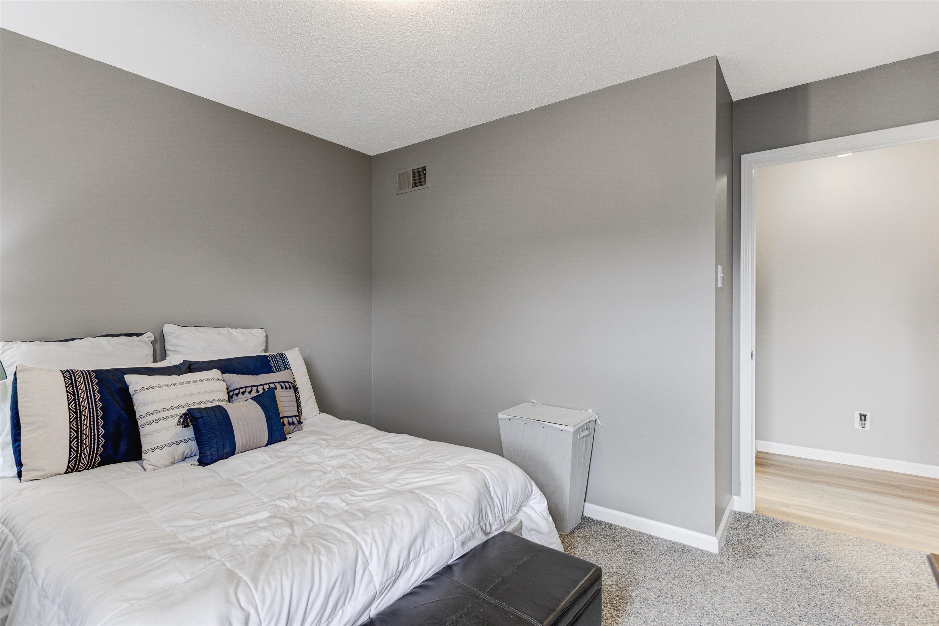 3224 Court Street Bartlett, TN 38134 - Photo 15 of 23 a bedroom with a bed and wooden floor