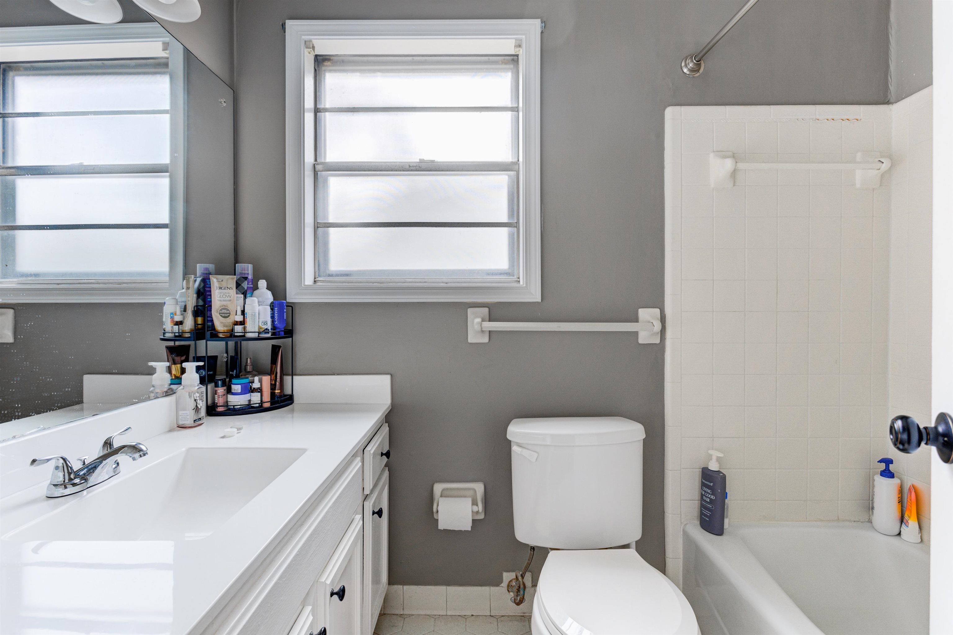 3224 Court Street Bartlett, TN 38134 - Photo 17 of 23 a bathroom with a toilet sink and mirror