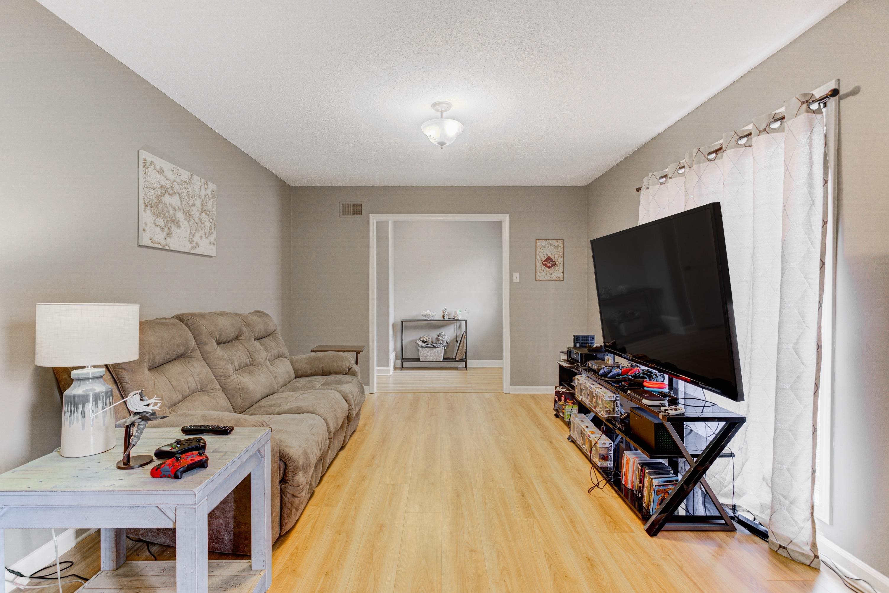 3224 Court Street Bartlett, TN 38134 - Photo 4 of 23 a living room with furniture and a flat screen tv