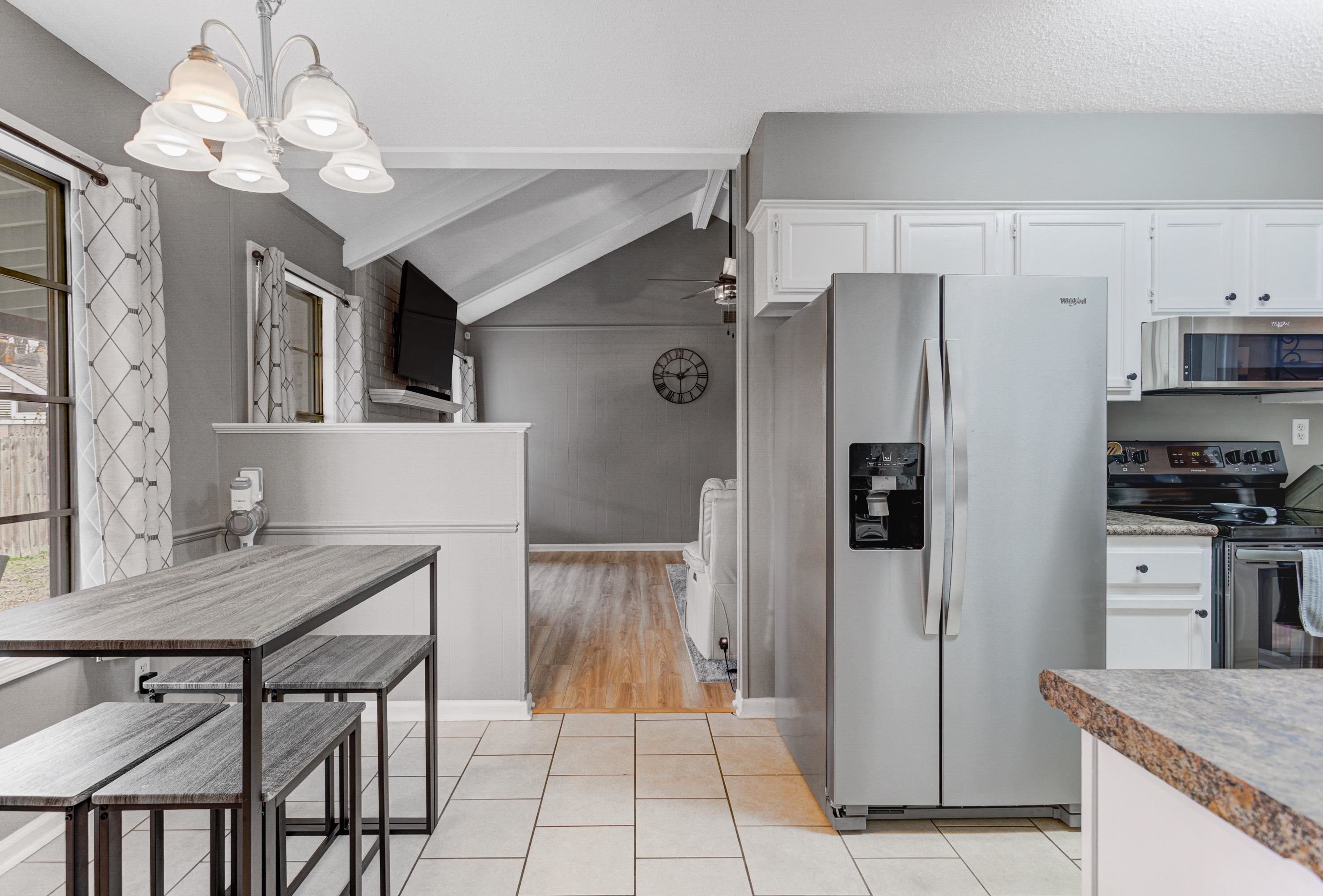 3224 Court Street Bartlett, TN 38134 - Photo 8 of 23 a kitchen with stainless steel appliances granite countertop a refrigerator and a stove top oven