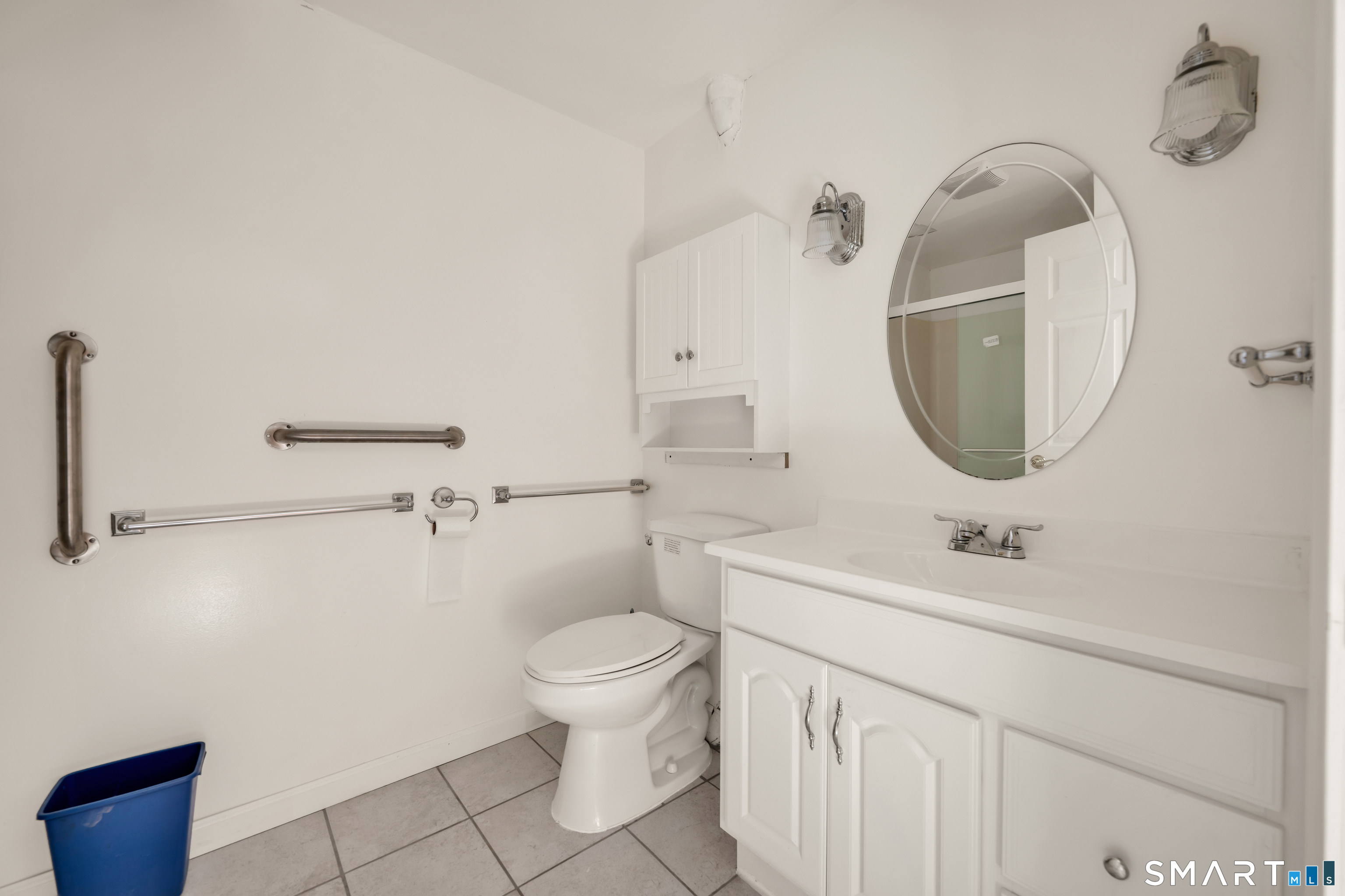 315 West Hill Road Torrington, CT 06790 - Photo 25 of 40 a bathroom with a sink toilet and mirror