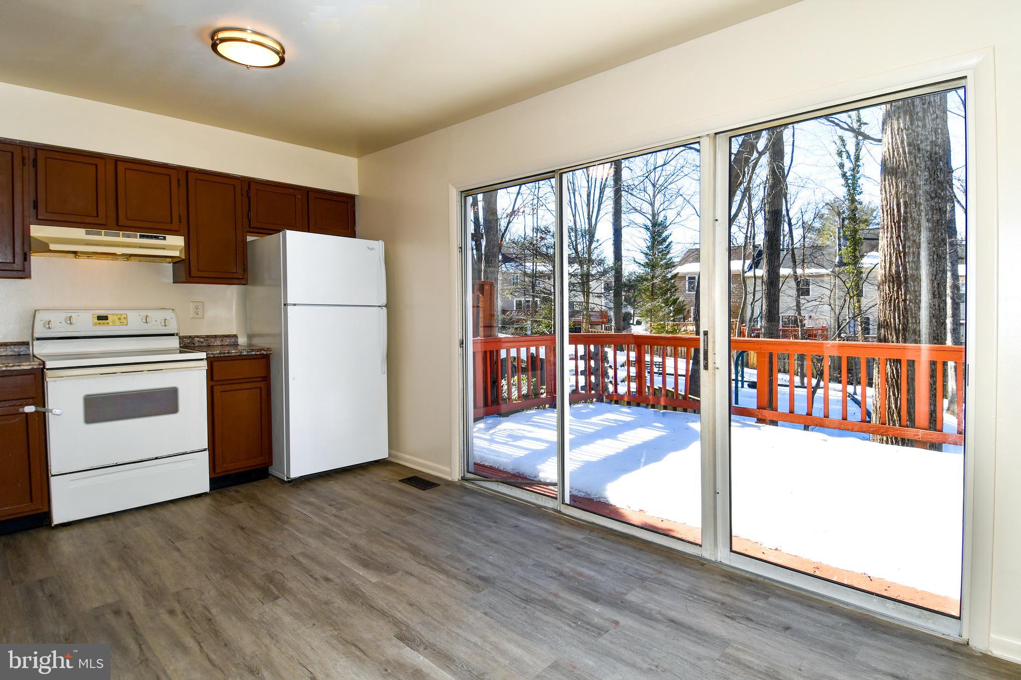 4 Waterside Court Germantown, MD 20874 - Photo 7 of 31 Kitchen opens to deck