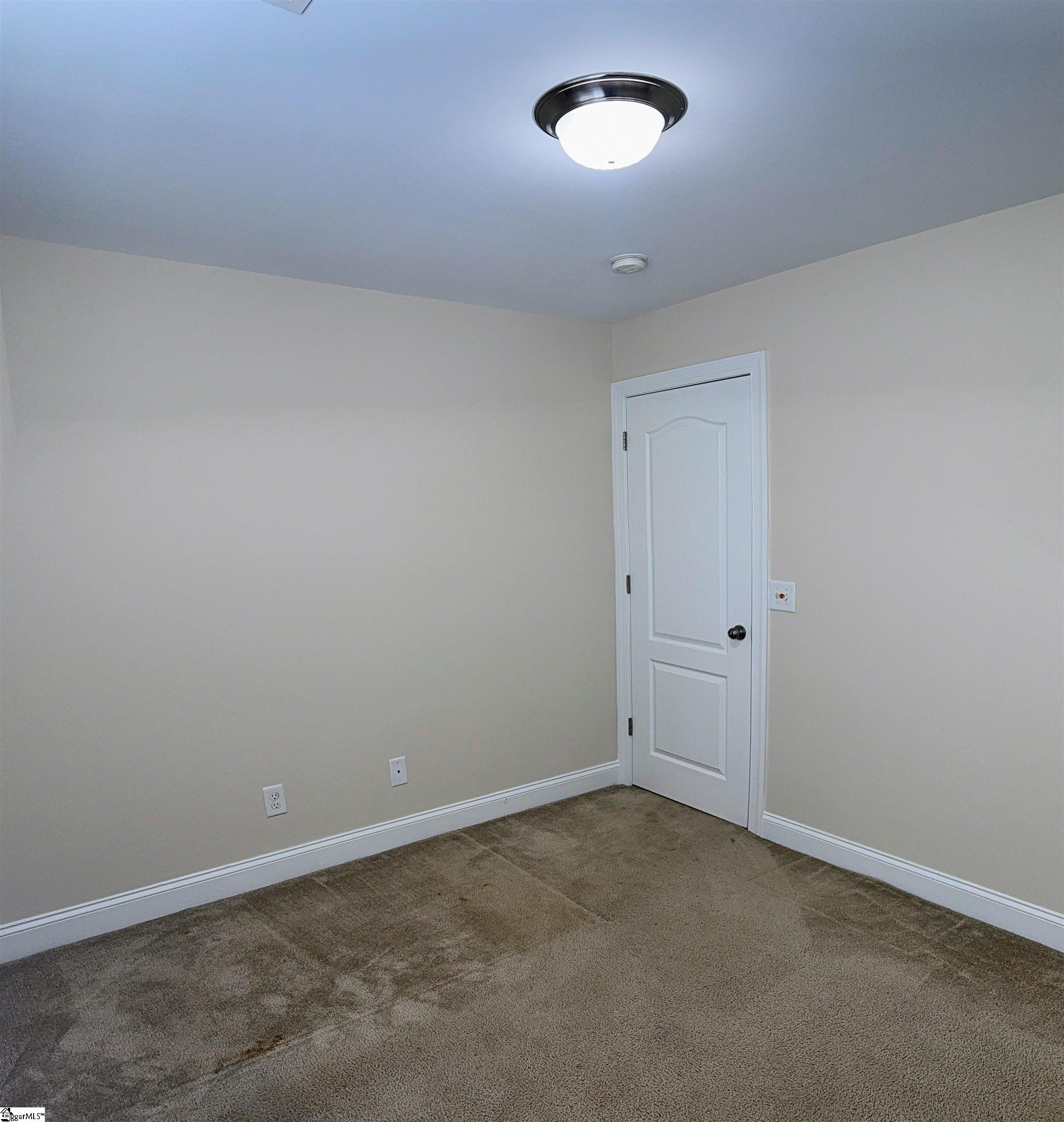 207 Penrith Court Simpsonville, SC 29681 - Photo 8 of 23 This photo was taken before the Brand New Carpets and blinds were installed in all the bedrooms.