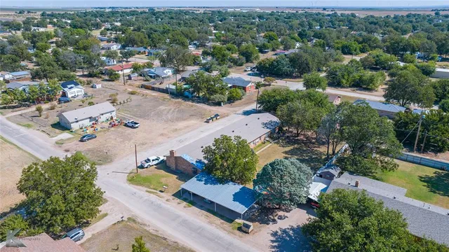 an aerial view of a house with a garden