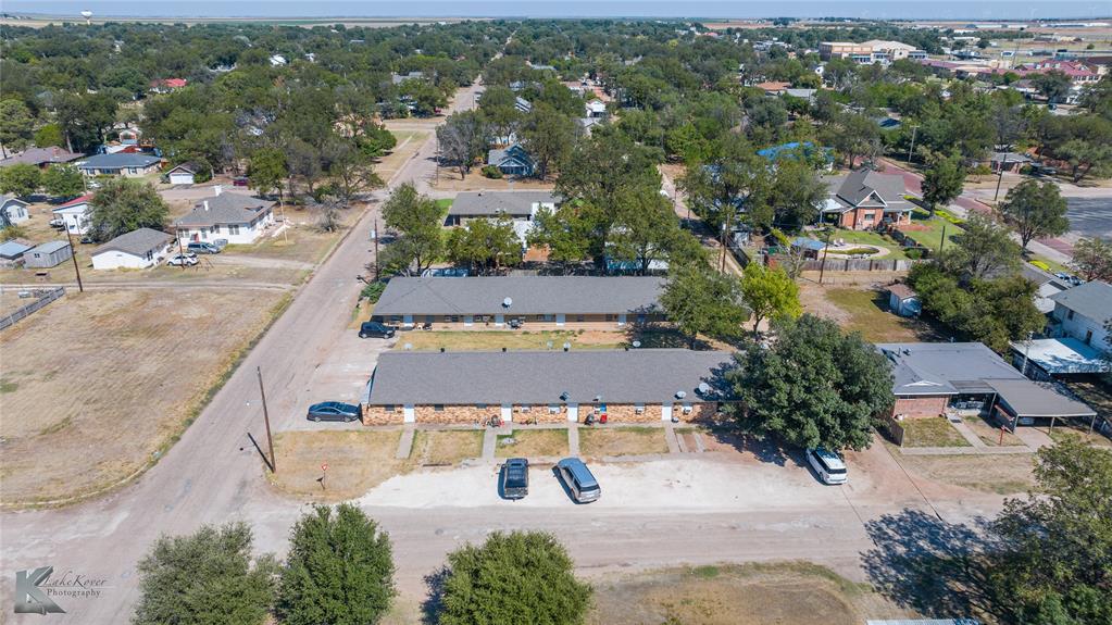 604 North 3rd Street Haskell, TX 79521 - Photo 7 of 19 an aerial view of a swimming pool with outdoor seating and mountain view