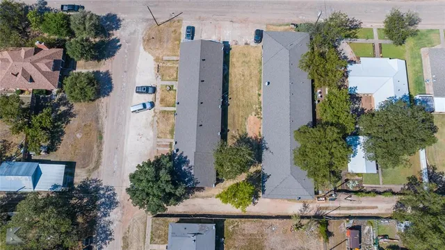 an aerial view of a house with outdoor space
