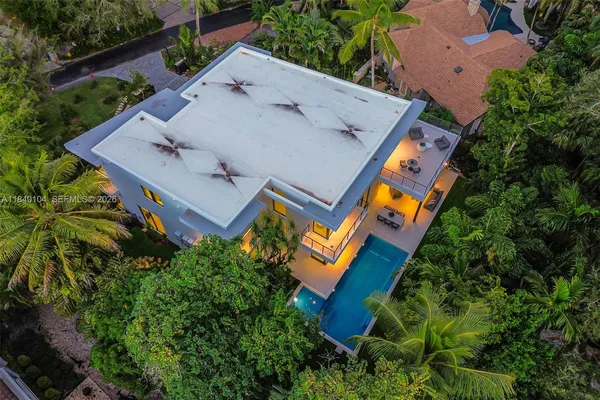 an aerial view of house with yard