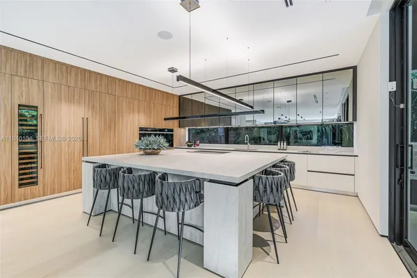 a dinning table and chairs in a room