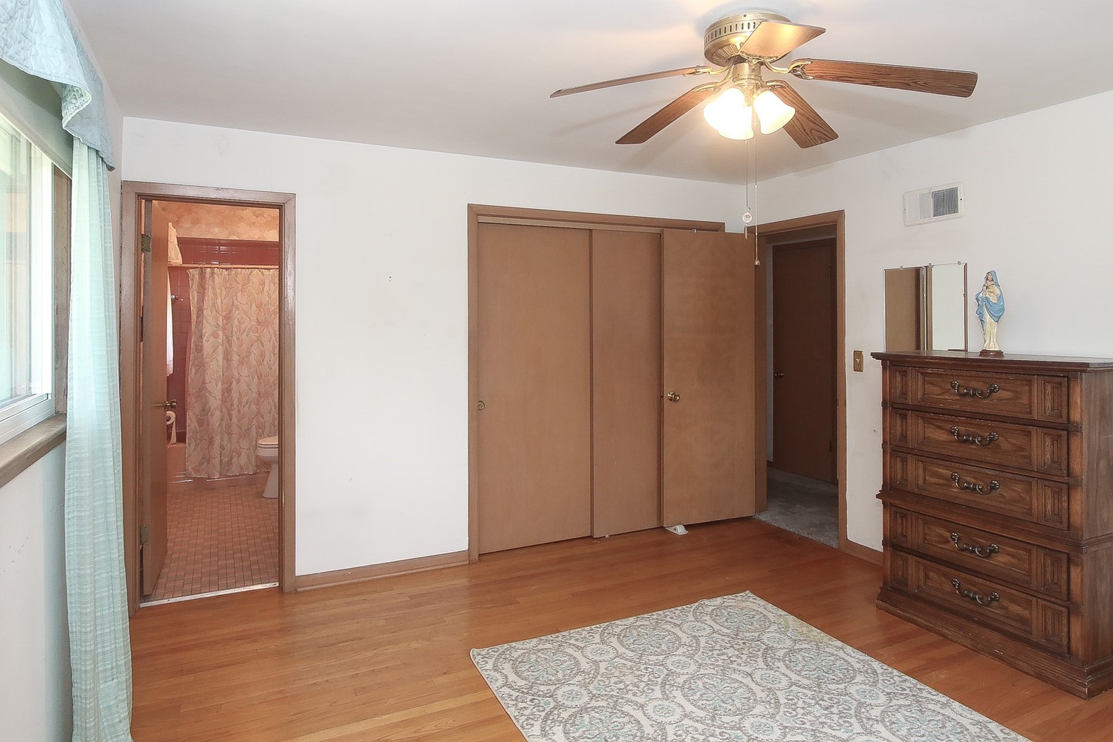300 South We Go Trail Mount Prospect, IL 60056 - Photo 11 of 27 a view of a bedroom with closet and wooden floor
