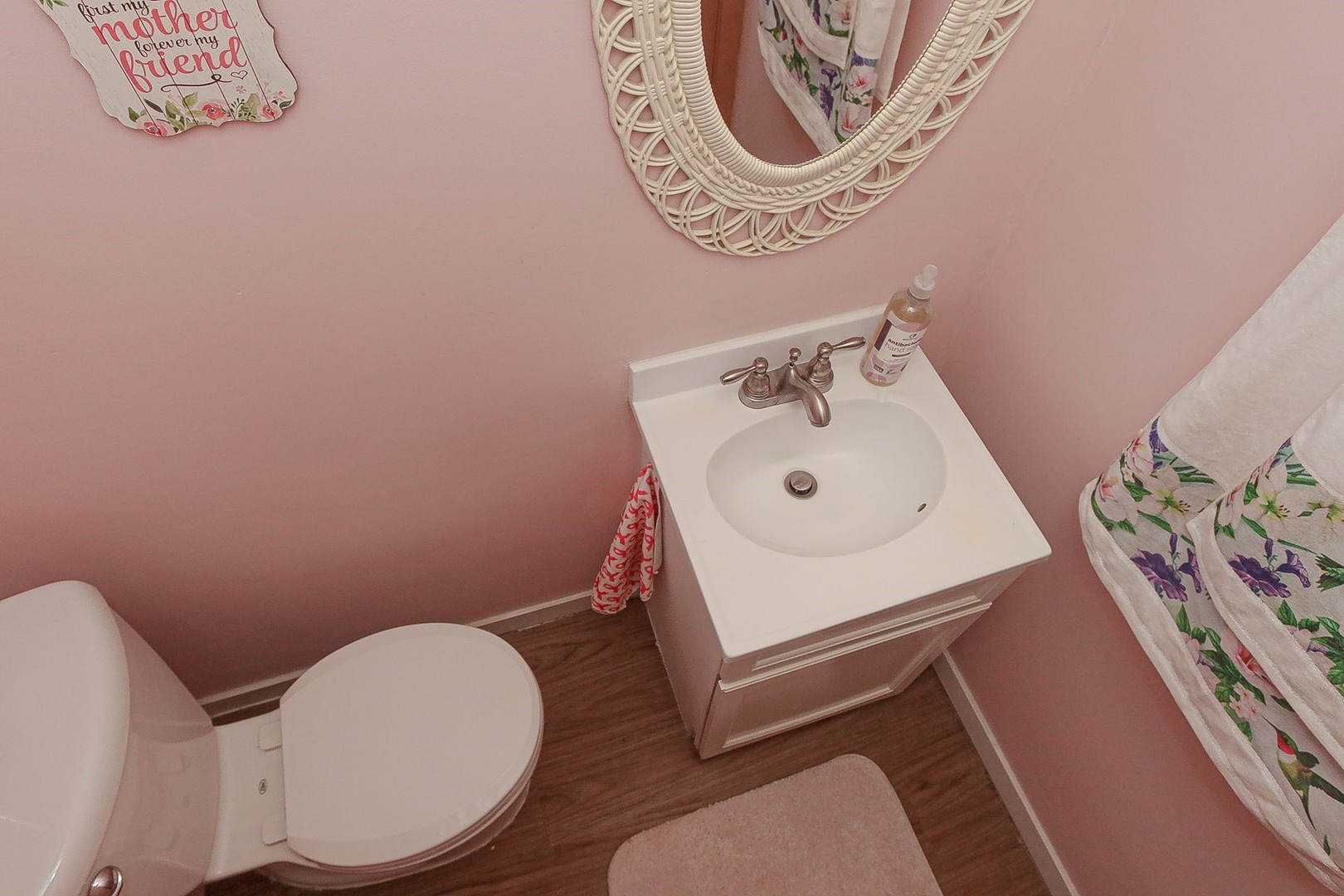 300 South We Go Trail Mount Prospect, IL 60056 - Photo 21 of 27 a bathroom with a toilet a sink and a mirror