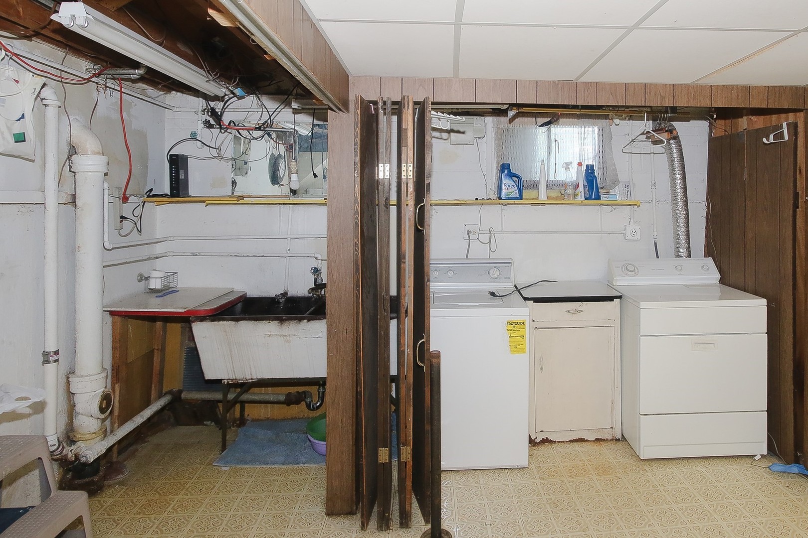300 South We Go Trail Mount Prospect, IL 60056 - Photo 24 of 27 a kitchen with a refrigerator and table chairs