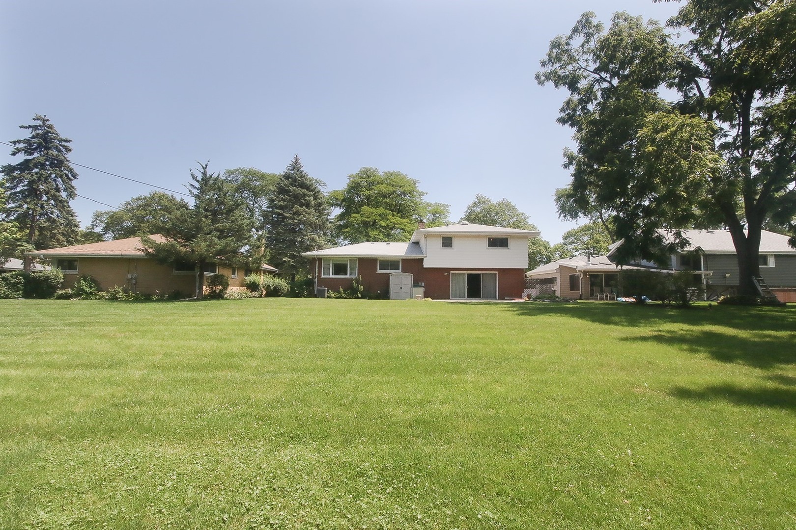 300 South We Go Trail Mount Prospect, IL 60056 - Photo 25 of 27 a front view of a house with a garden and yard
