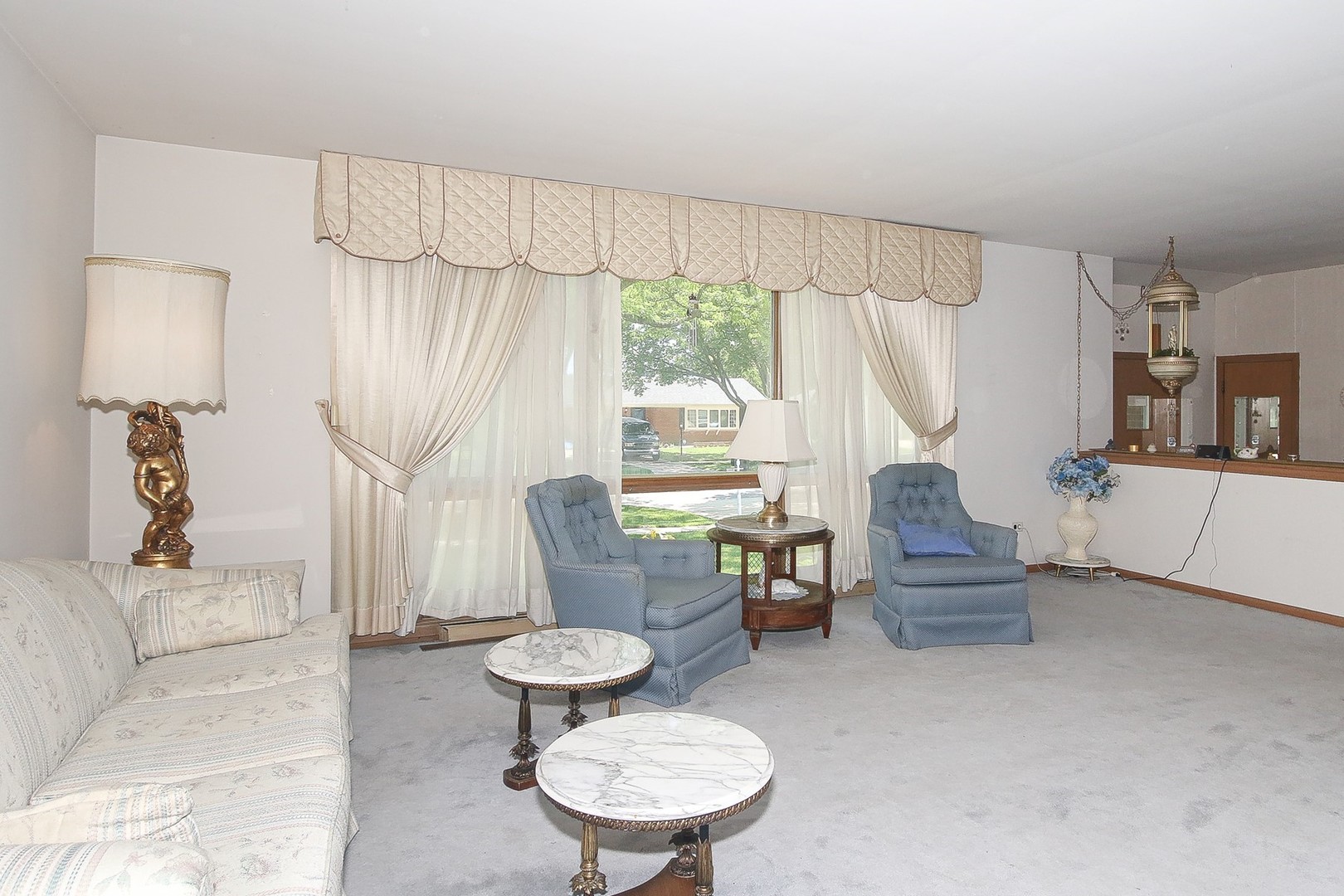 300 South We Go Trail Mount Prospect, IL 60056 - Photo 6 of 27 a living room with furniture a table and a large window