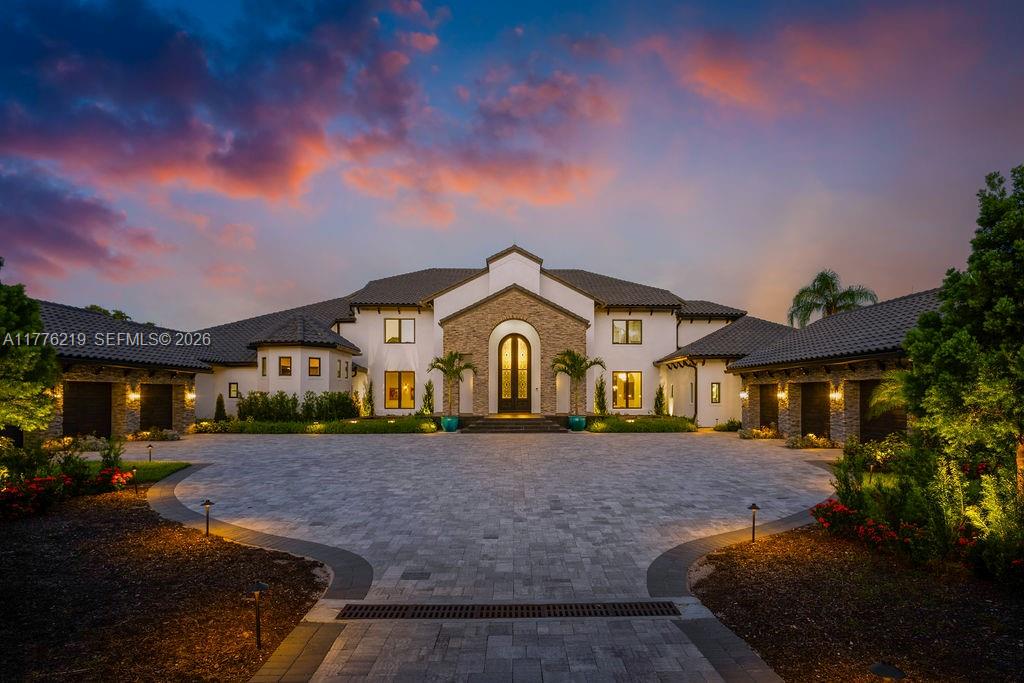 570 Manor Road Maitland, FL 32751 - Photo 2 of 100 a front view of a house with a yard and large trees