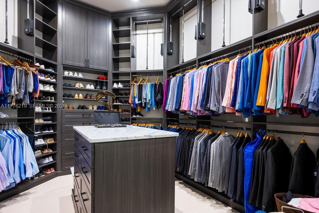 570 Manor Road Maitland, FL 32751 - Photo 36 of 100 a view of walk in closet with clothes and shoes