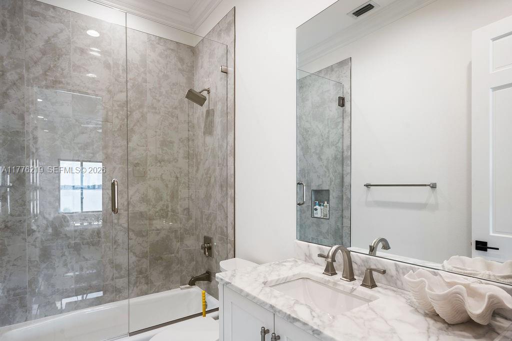 570 Manor Road Maitland, FL 32751 - Photo 53 of 100 a bathroom with a granite countertop sink a toilet and shower