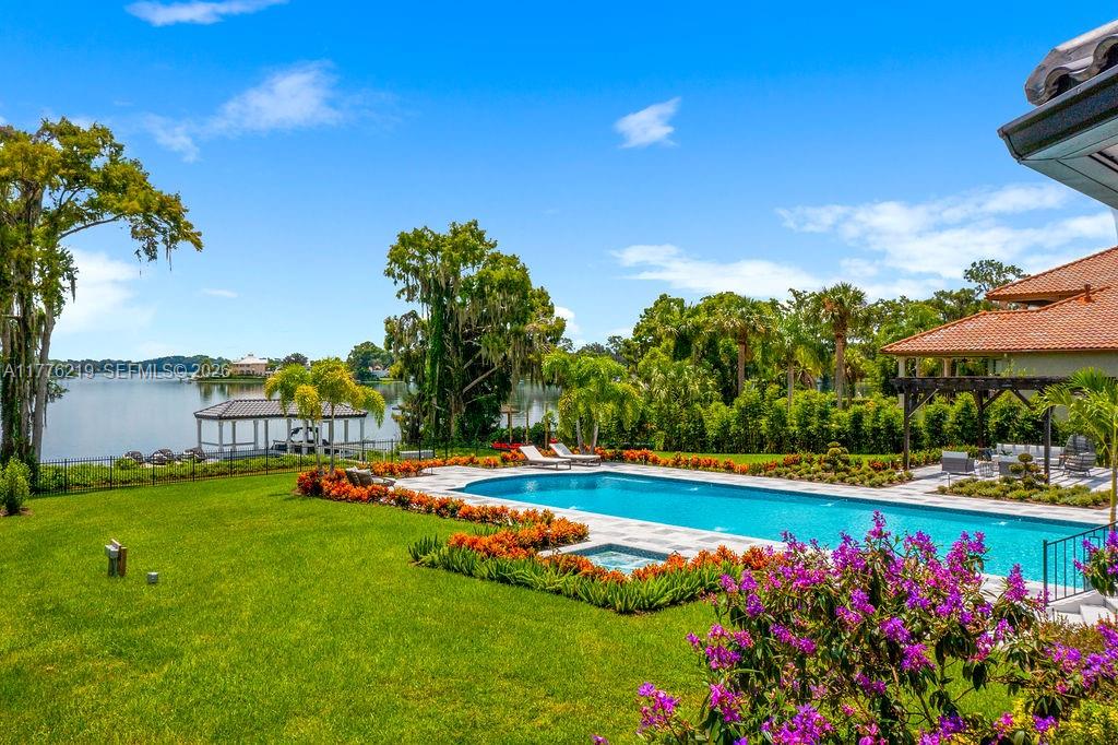 570 Manor Road Maitland, FL 32751 - Photo 77 of 100 a view of a swimming pool with an outdoor seating