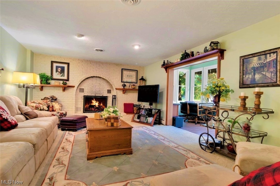 42175 Butternut Ridge Road Elyria, OH 44035 - Photo 19 of 35 The 1st floor Family room is another room for entertaining. This 20x14 space has a brick wall surrounding the woodburner fireplace. Room was painted in 2018.