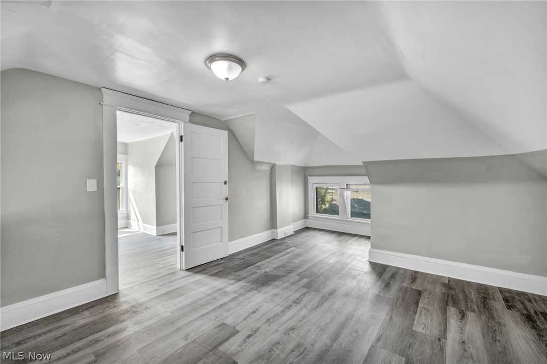 1659 Lee Road Cleveland, OH 44118 - Photo 34 of 46 Spacious room featuring wood-finish flooring, white trim, a multi-panel door, and a built-in window