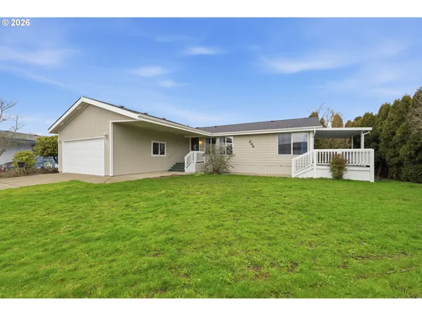 a view of a backyard with a garden and plants