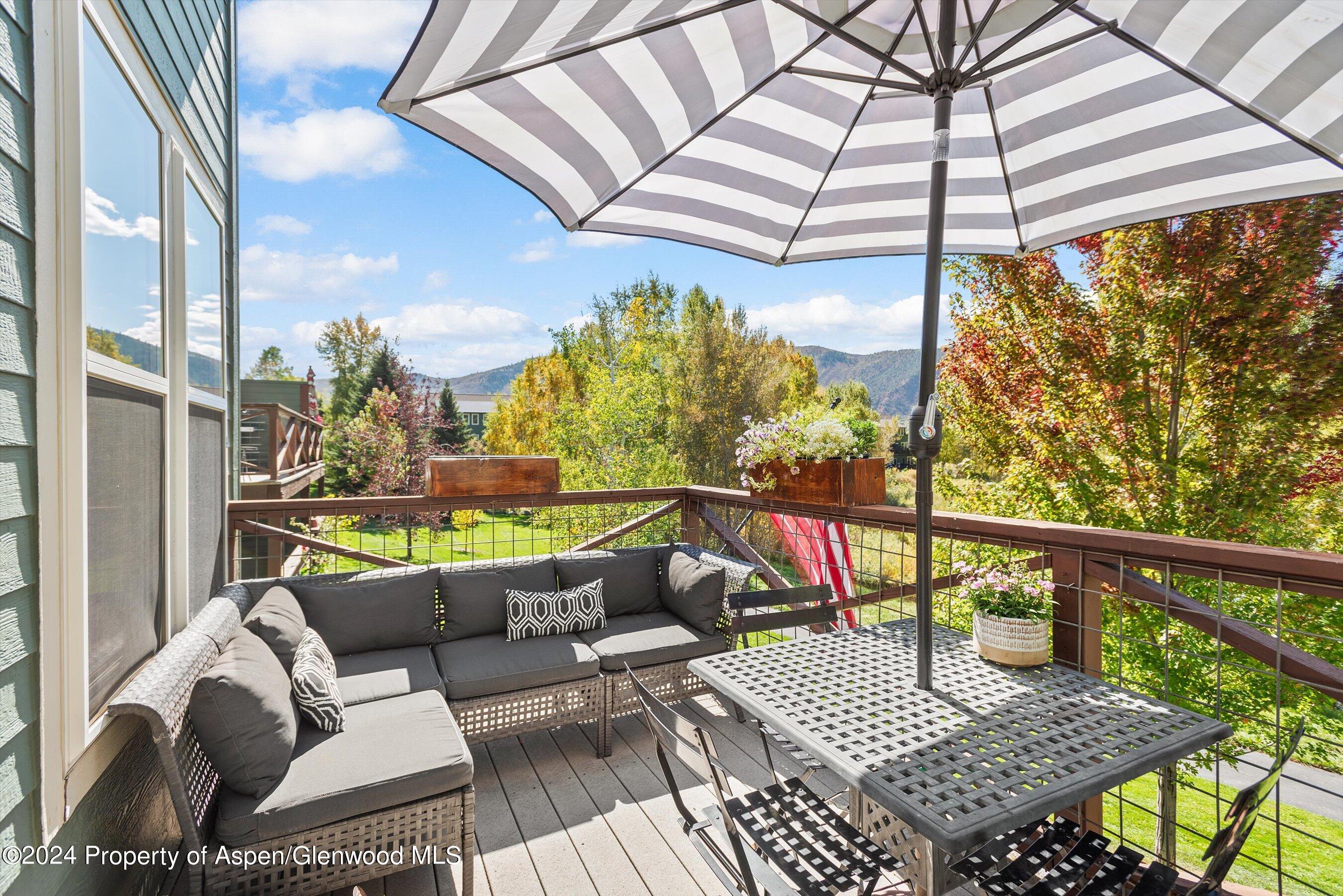 214 Lakeside Drive Basalt, CO 81621 - Photo 10 of 31 a view of balcony with wooden floor and outdoor seating