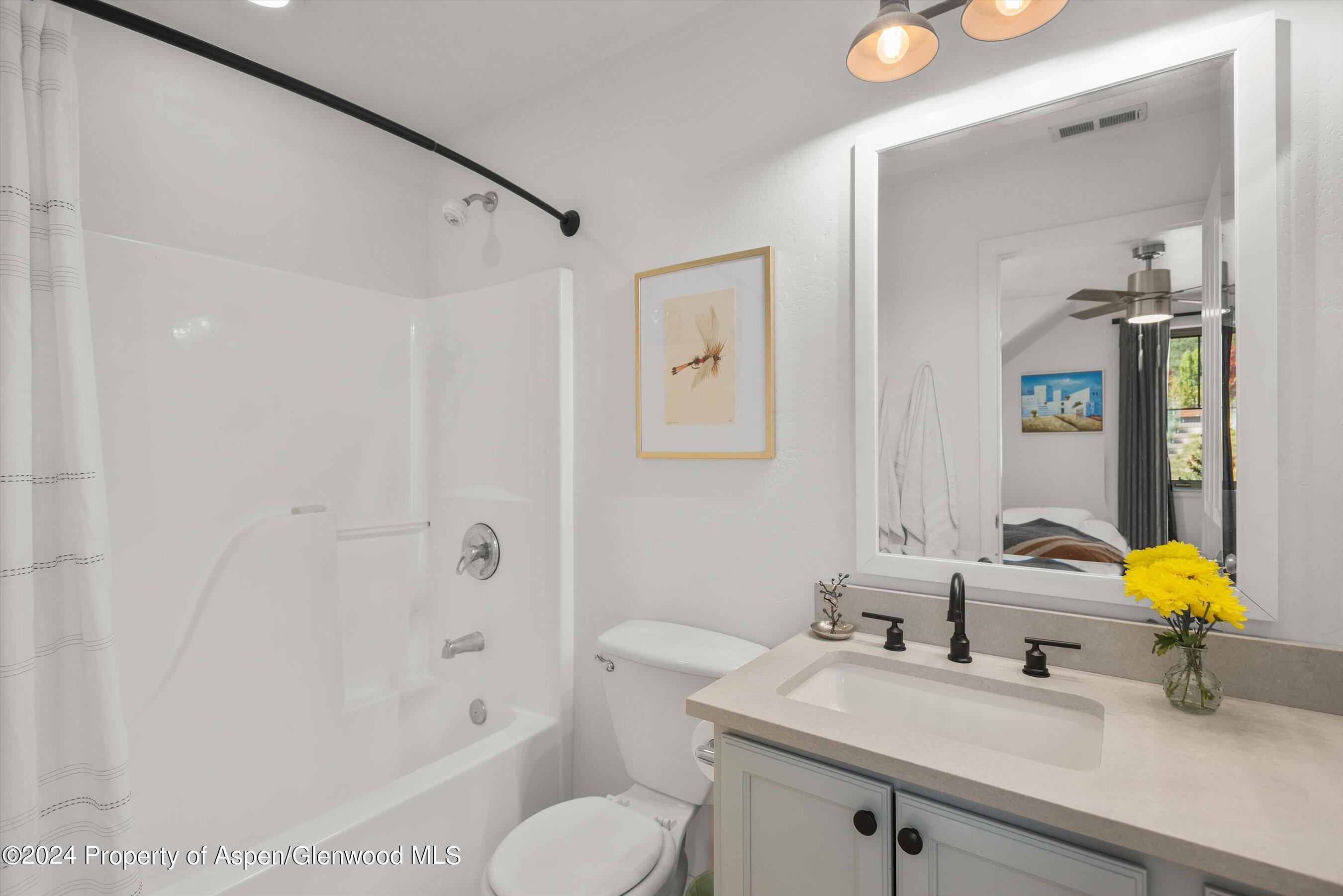 214 Lakeside Drive Basalt, CO 81621 - Photo 15 of 31 a bathroom with a sink toilet and shower