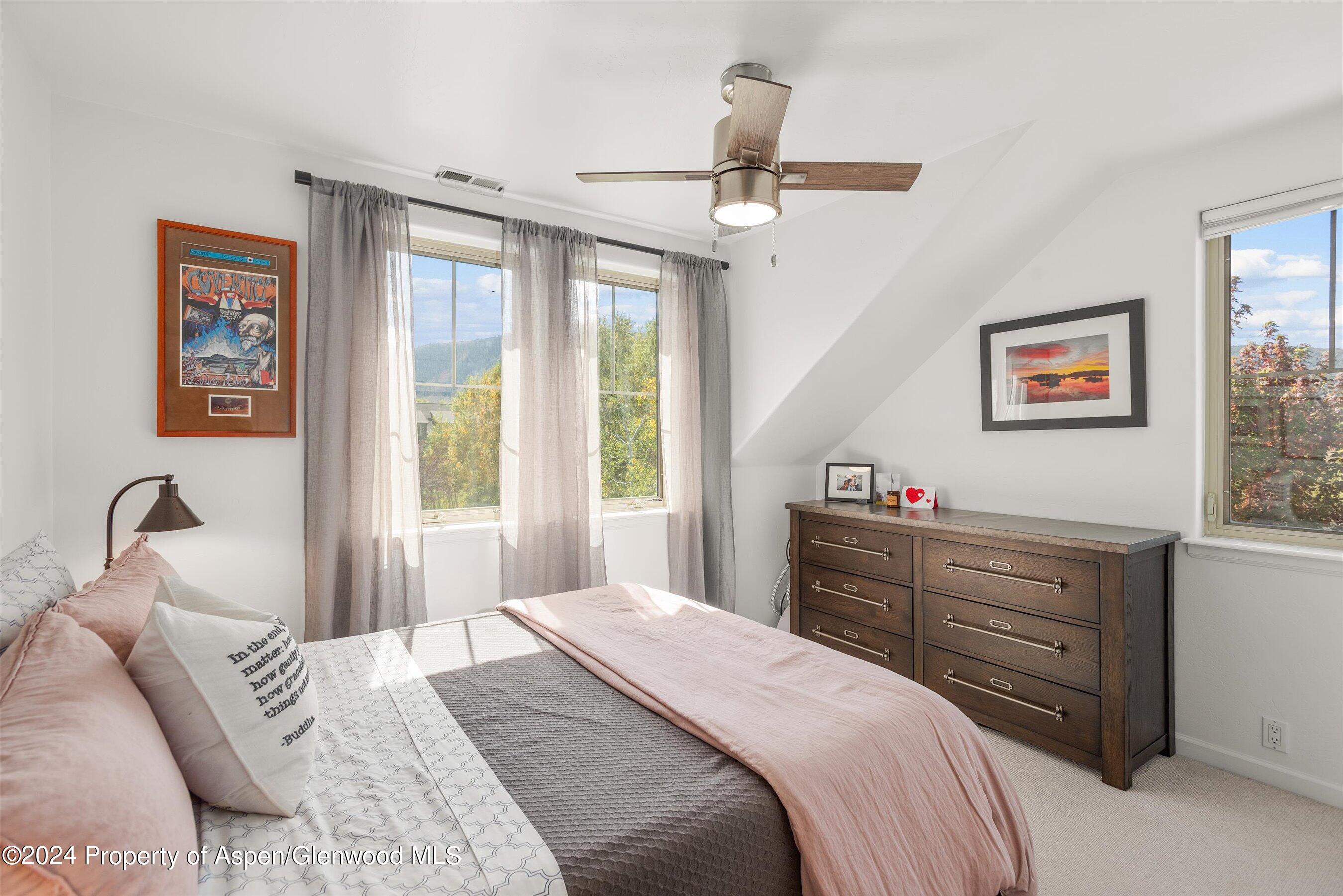 214 Lakeside Drive Basalt, CO 81621 - Photo 16 of 31 a bedroom with a bed and a dresser