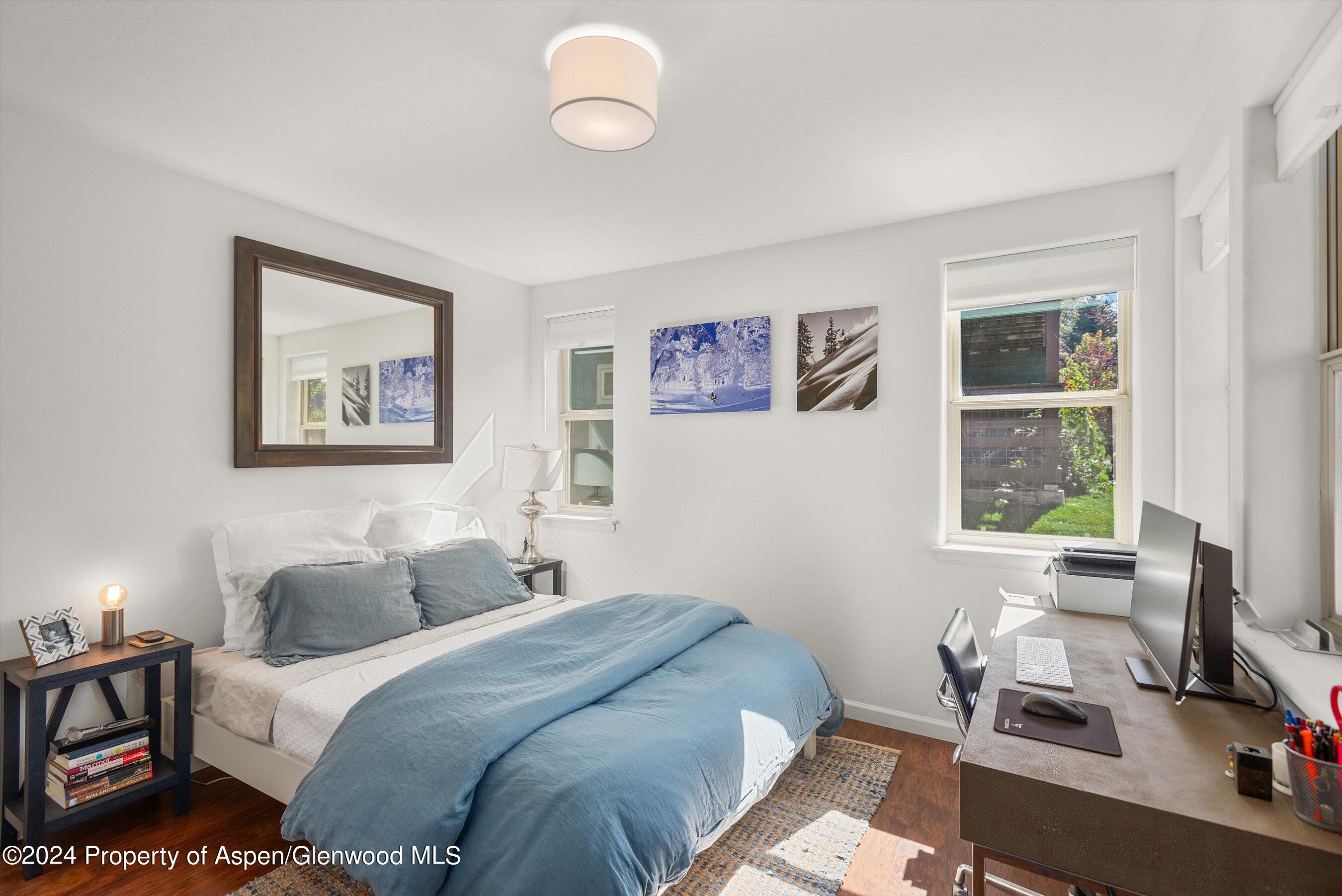 214 Lakeside Drive Basalt, CO 81621 - Photo 19 of 31 a bedroom with a bed and a window