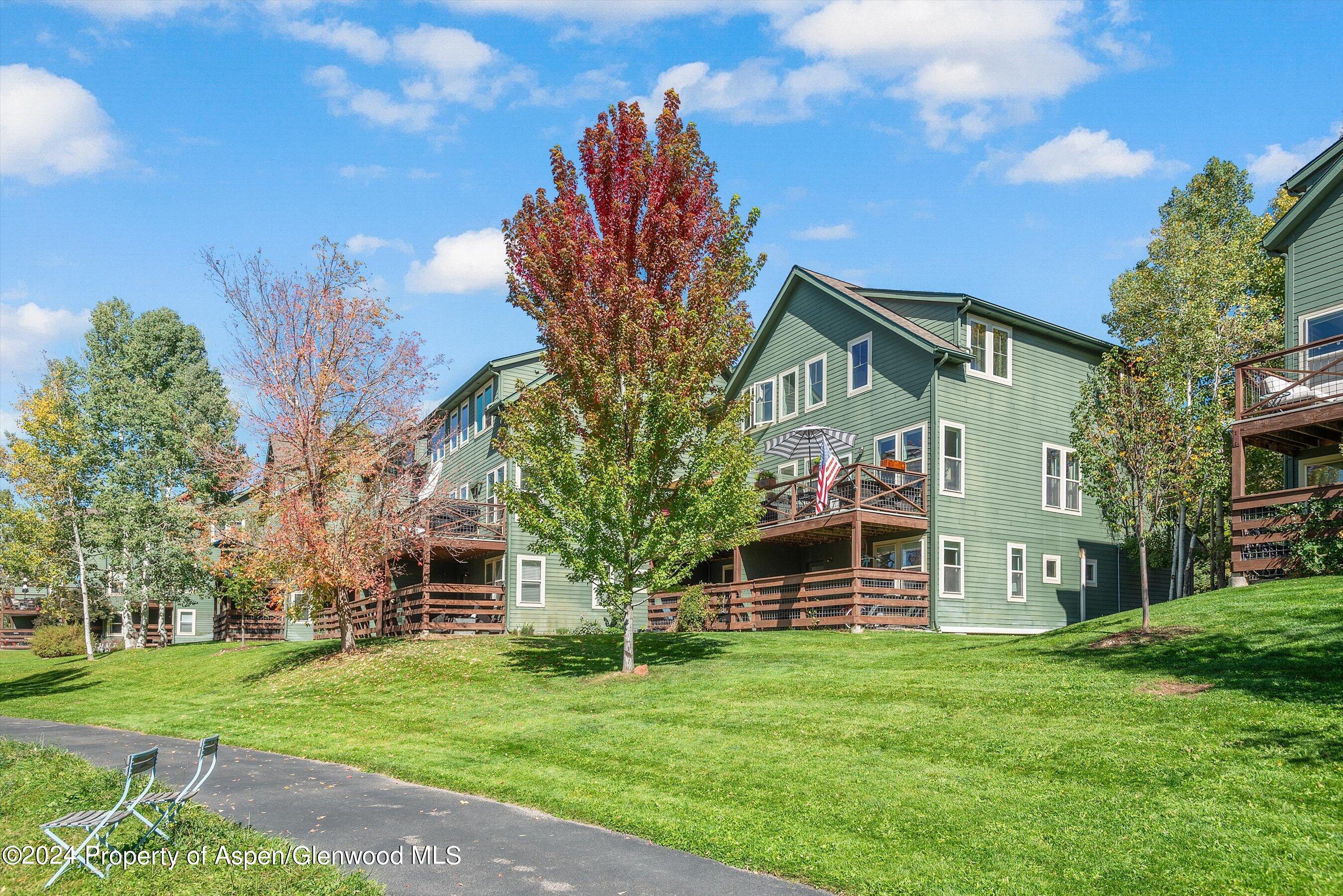 214 Lakeside Drive Basalt, CO 81621 - Photo 25 of 31 a front view of a house with a garden