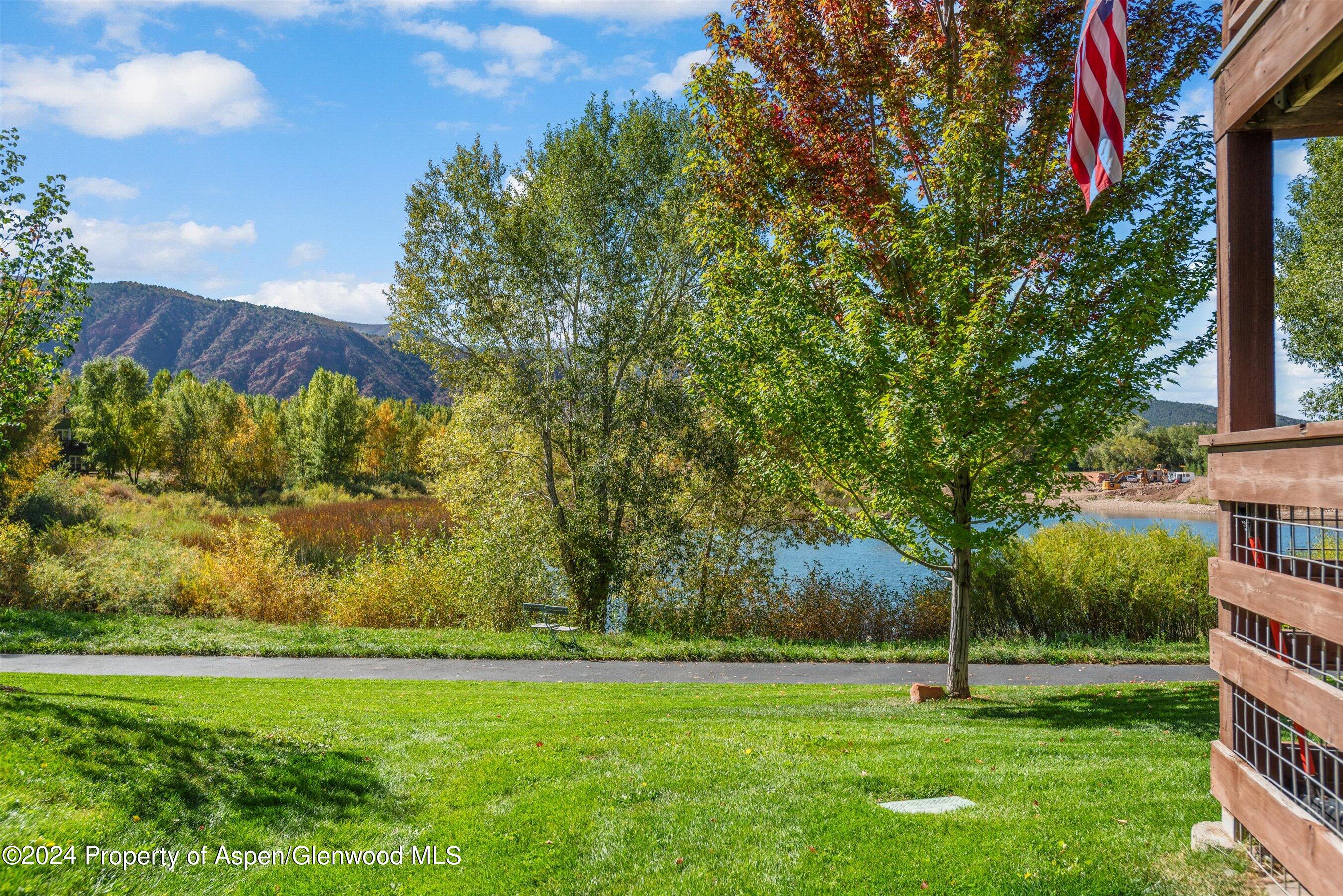 214 Lakeside Drive Basalt, CO 81621 - Photo 27 of 31 a view of a backyard with large trees