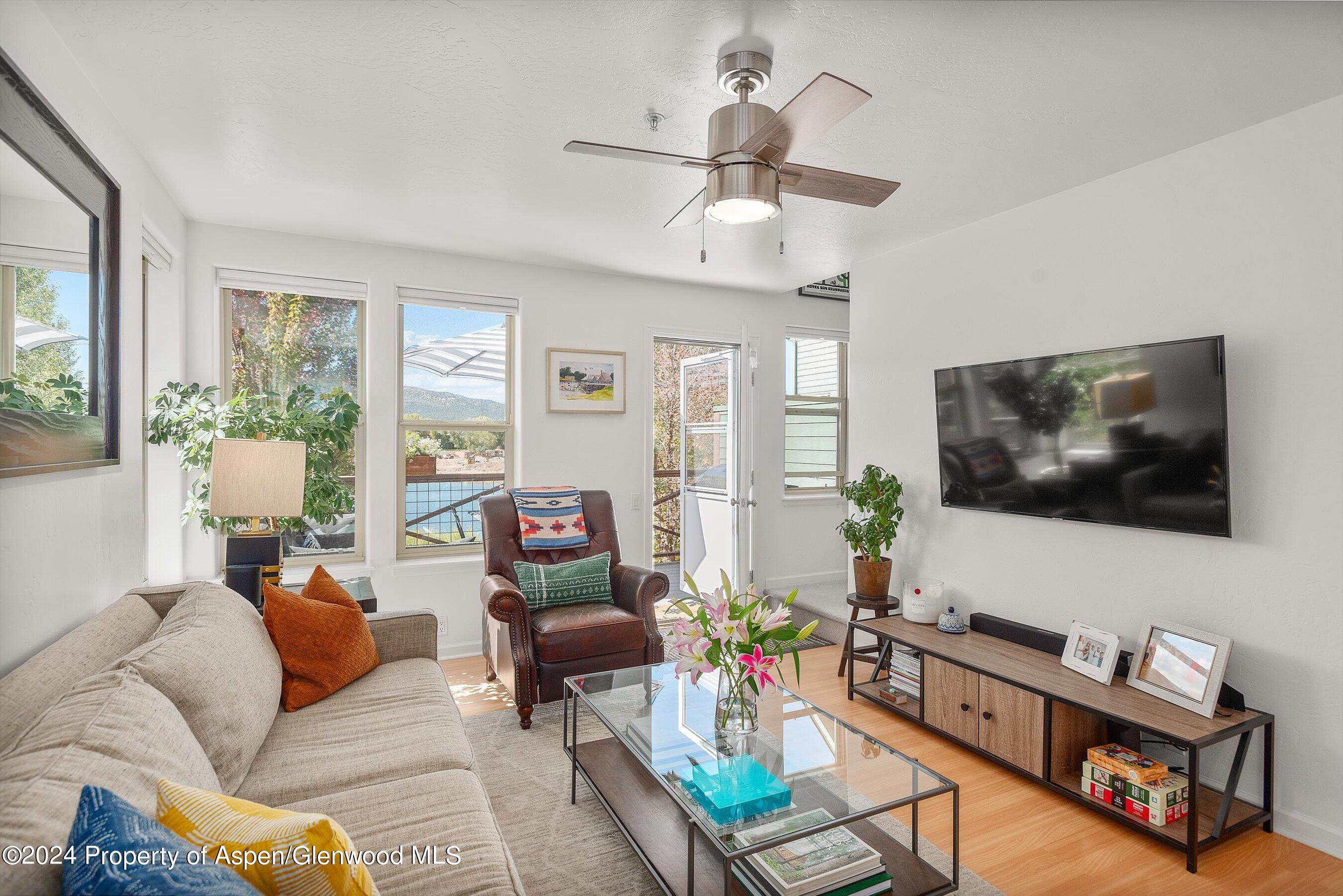214 Lakeside Drive Basalt, CO 81621 - Photo 7 of 31 a living room with furniture and a flat screen tv