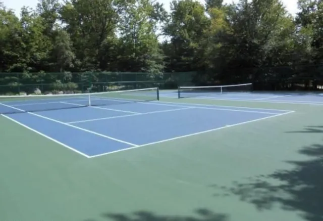 a table and chairs in front of a house