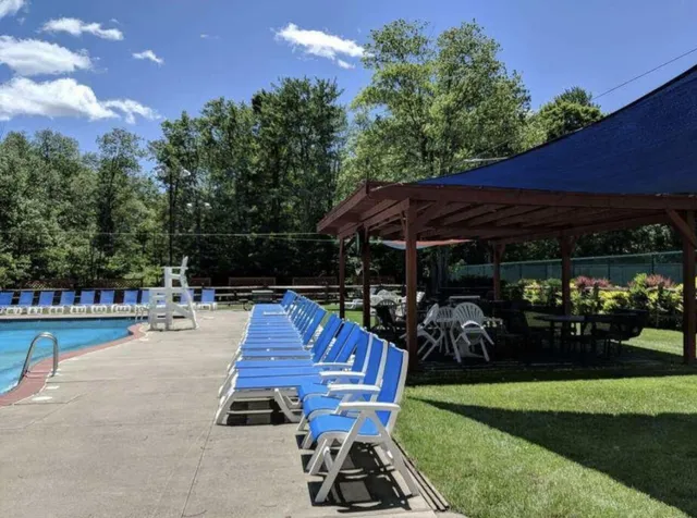 a view of a balcony with chairs