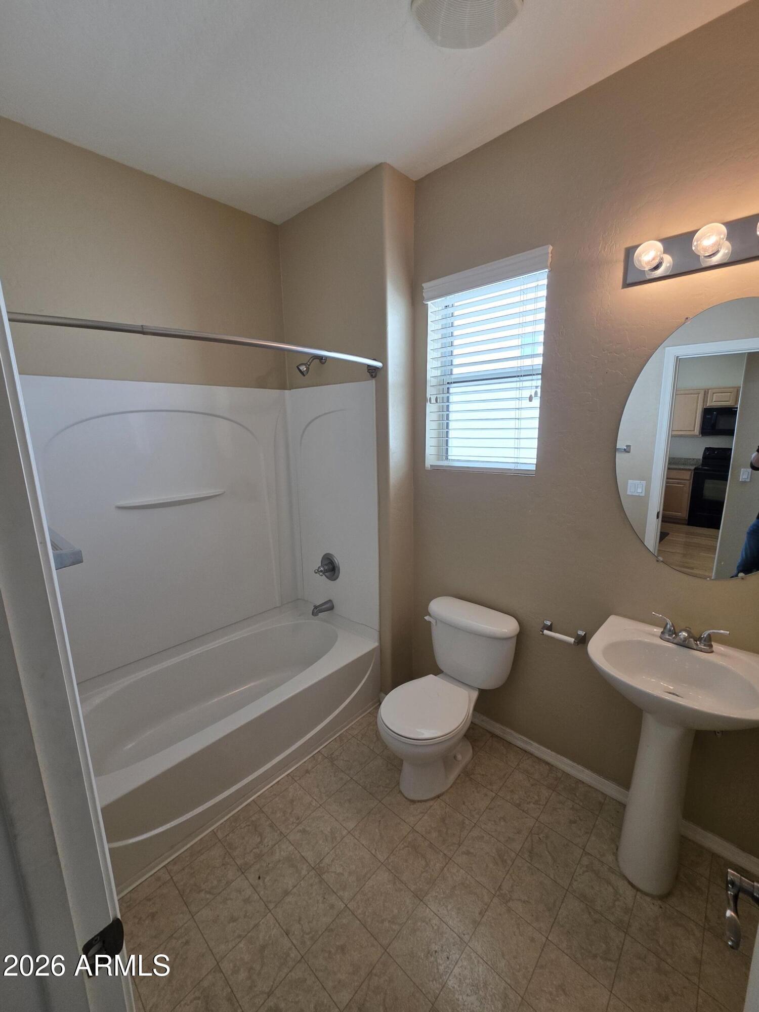 942 West Aspen Way Gilbert, AZ 85233 - Photo 15 of 18 a bathroom with a sink toilet and shower