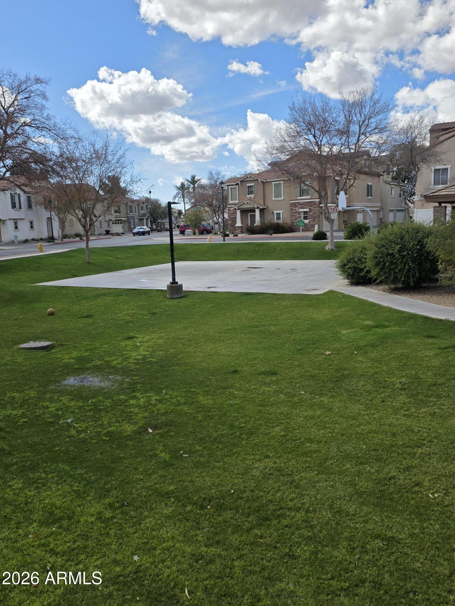 942 West Aspen Way Gilbert, AZ 85233 - Photo 17 of 18 a view of a golf course with a lake
