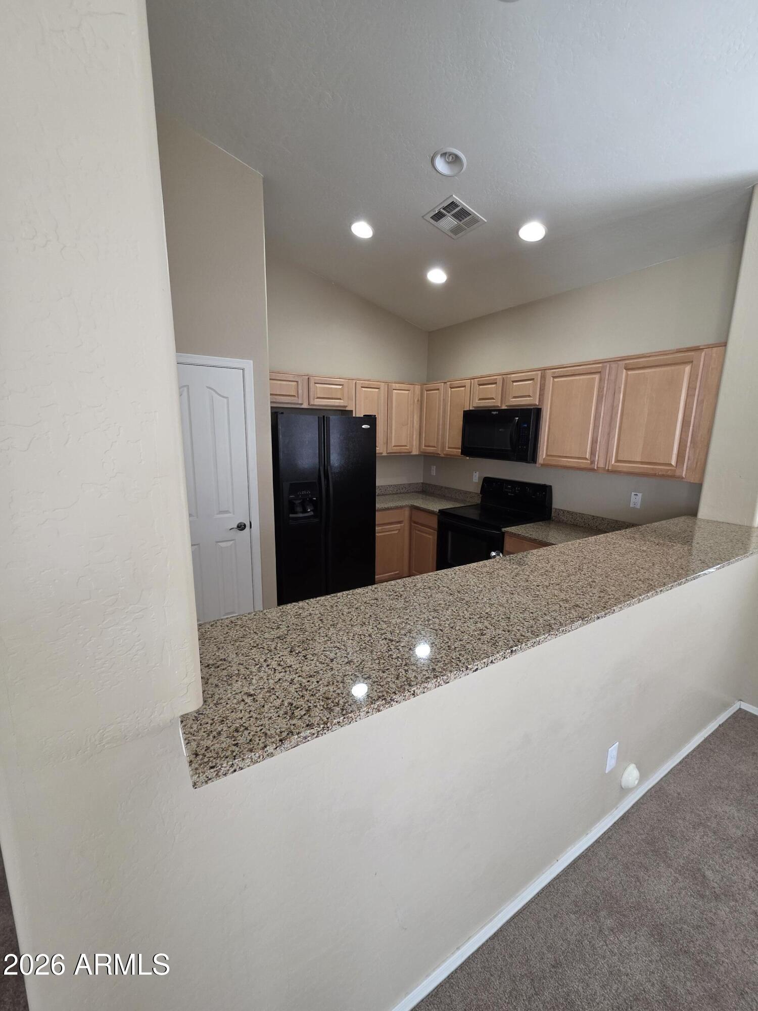 942 West Aspen Way Gilbert, AZ 85233 - Photo 8 of 18 a view of kitchen and refrigerator