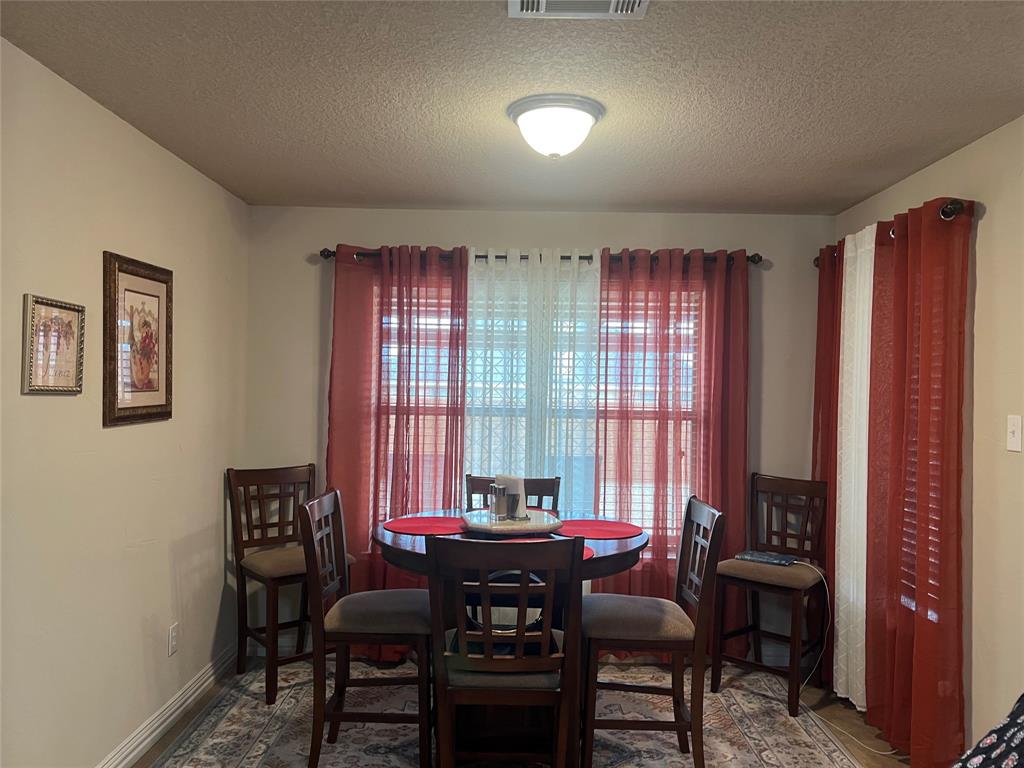 312 McAfee Street Mabank, TX 75147 - Photo 34 of 40 a view of a dining room with furniture window and outside view