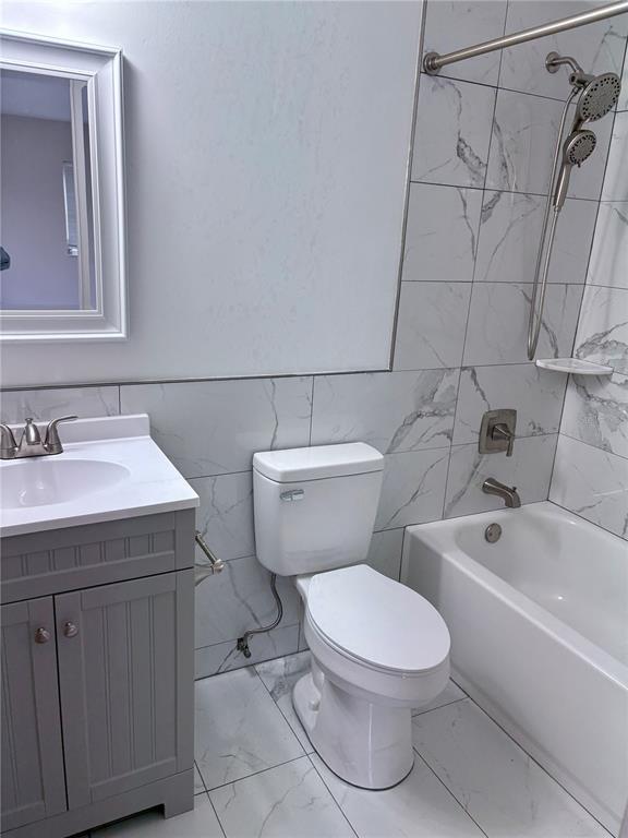 33 Spring Loop Ocala, FL 34472 - Photo 11 of 28 a white toilet sitting next to a bathroom sink