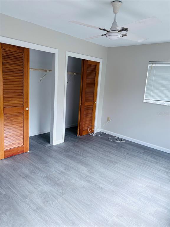 33 Spring Loop Ocala, FL 34472 - Photo 13 of 28 a view of empty room with wooden floor and fan