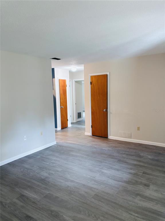 33 Spring Loop Ocala, FL 34472 - Photo 15 of 28 an empty room with wooden floor and a window