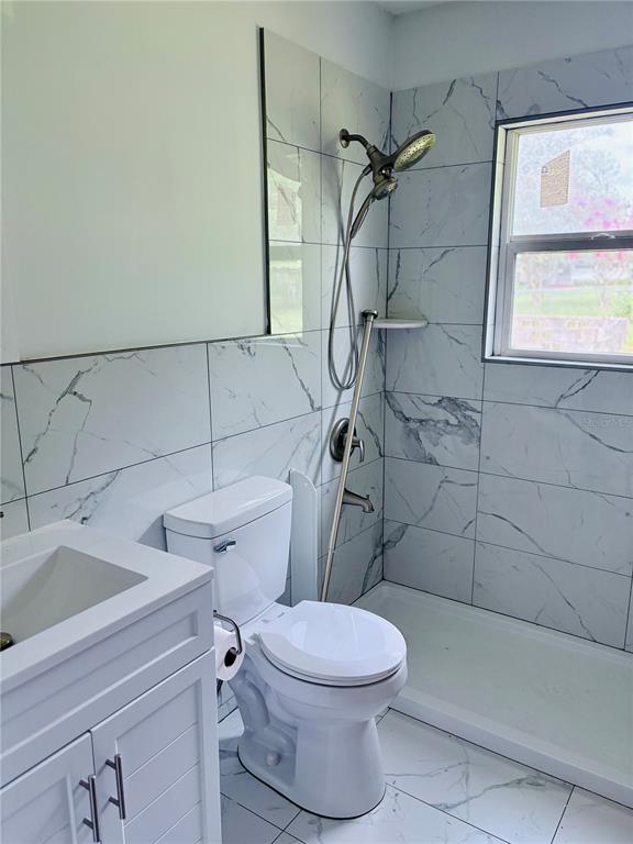 33 Spring Loop Ocala, FL 34472 - Photo 16 of 28 a bathroom with a toilet sink and shower