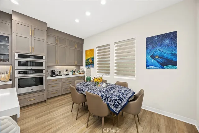 a utility room with sink dryer and washer