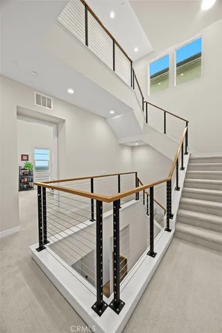 a view of roof deck with outdoor seating and ocean view