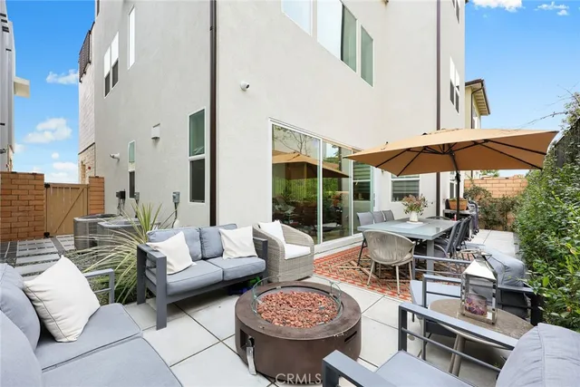 a swimming pool with outdoor seating and yard