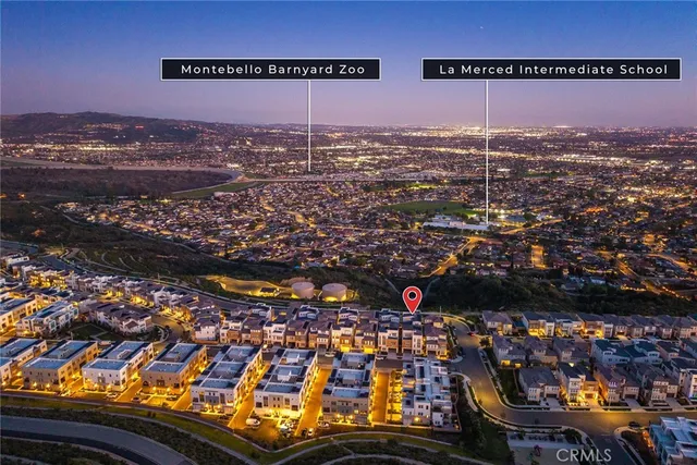 a view of a city with mountains in the background