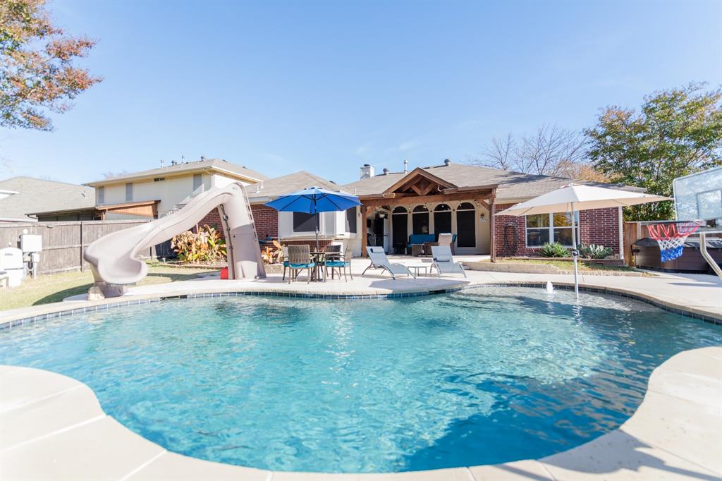 2107 Lacebark Lane Rockwall, TX 75087 - Photo 19 of 34 a front view of a house with swimming pool having outdoor seating